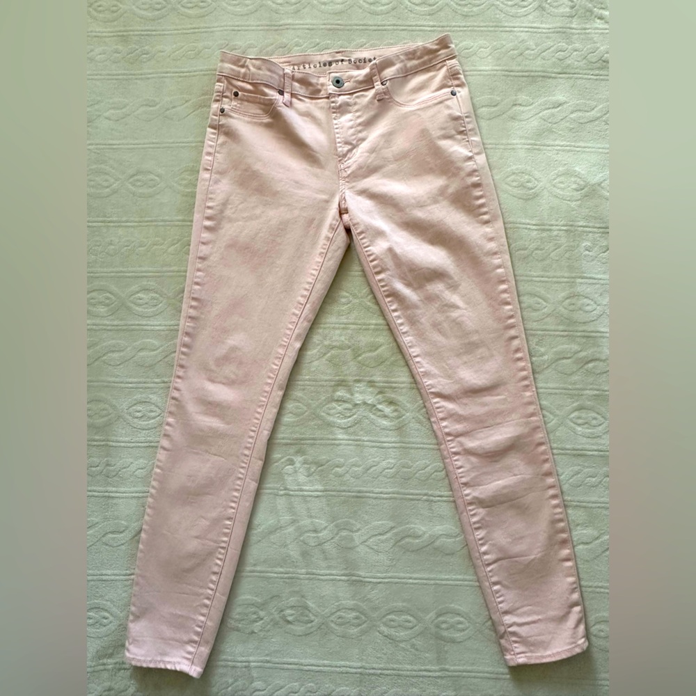 Baby pink slim fit jeans.